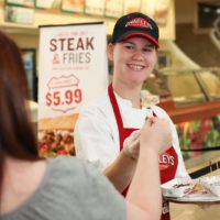 Charleys franchise employee giving out samples