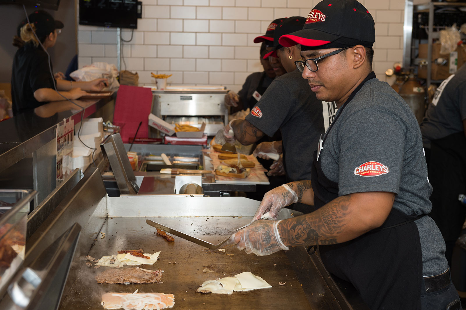 Charleys franchise employee at grill