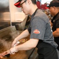 Charleys franchise employee at grill